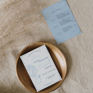 May include: A blue and white invitation for a bachelorette weekend called "Olina's Denim Diamonds Bachelorette Weekend" with the dates June 6th-8th, 2023 and the location 123 Anywhere Street, Nashville, TN.