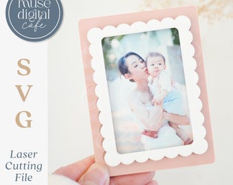 May include: A pink photo frame with a scalloped white border, holding a photo of a mother and child. The frame is designed for 2x3 and 2.5x3.5 inch wallet photos. The image includes the text "muse digital cafe" and "SVG Laser Cutting File."
