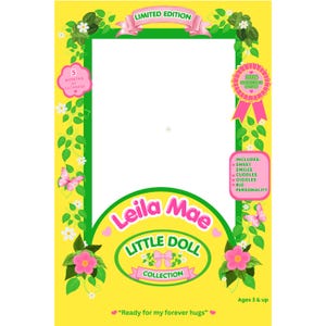 May include: A yellow rectangular frame with a green border decorated with green vines, white flowers, and pink butterflies. It features text including Limited Edition, 2026 Collector's Edition, Leila Mae Little Doll Collection, and Ready for my forever hugs.