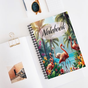 May include: Spiral-bound notebook featuring a tropical scene with flamingos, palm trees, and the word "Notebook" in script. The cover design includes vibrant colors of pink, orange, green, and blue, evoking a beach theme.