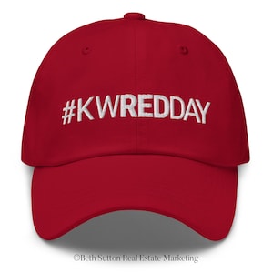 May include: Red baseball cap with white embroidered text that reads "#KWREDDAY".
