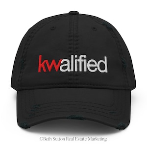 May include: Black distressed baseball cap with the word "kwaliified" embroidered in white with a red "k".