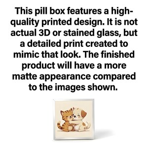 May include: A square pill box with a printed design featuring a cat and dog hugging. The text on the image states the design is a detailed print, not 3D or stained glass, with a matte finish.
