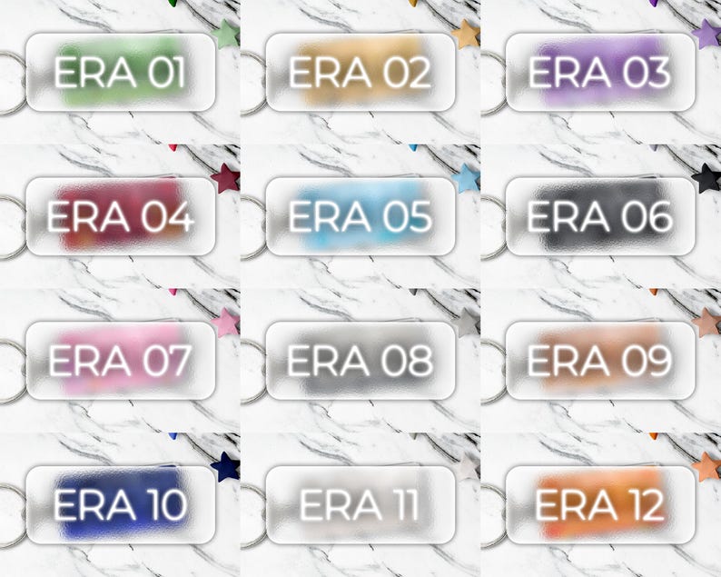 May include: A collection of twelve keychains, each with a rectangular, frosted glass design. Each keychain displays the text "ERA" followed by a number from 01 to 12, in a variety of colors. The background is a white marble pattern.
