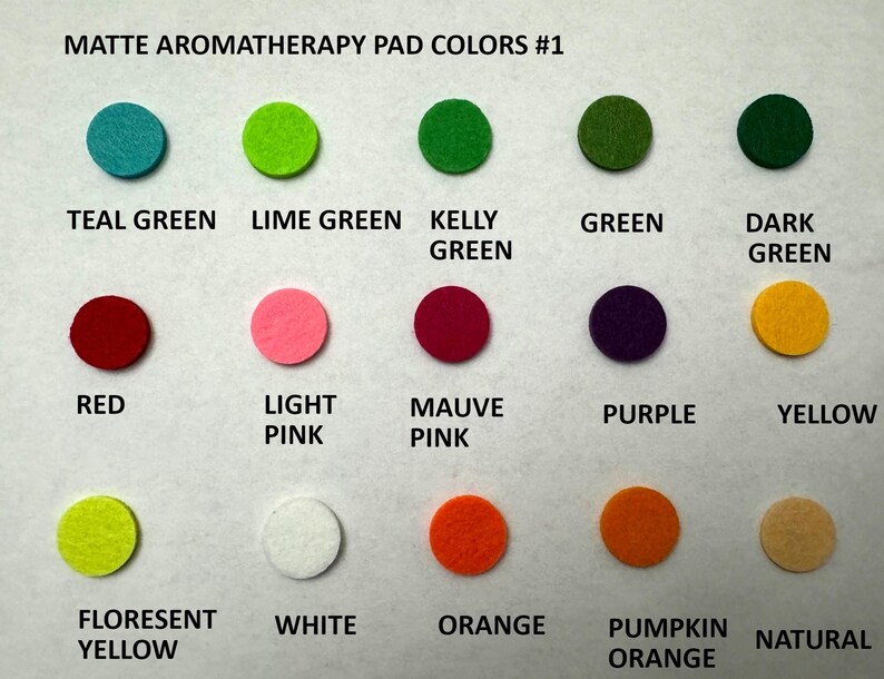 May include: A chart showing 12 different colors of felt aromatherapy pads. The colors are teal green, lime green, kelly green, green, dark green, red, light pink, mauve pink, purple, yellow, florescent yellow, white, orange, pumpkin orange, and natural.
