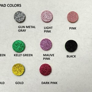 May include: A chart showing 12 different colors of sparkle pad material. The colors are silver, gun metal gray, light pink, pink, blue, light green, kelly green, mauve pink, black, red, light gold, and dark pink.