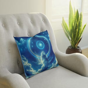 May include: A blue and white throw pillow with a swirling galaxy design. The pillow features a bright white star in the center of the galaxy.