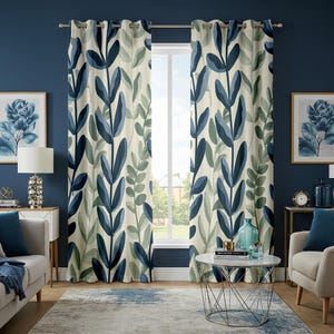 May include: A pair of floral patterned curtains with a cream background and a repeating design of blue and green leaves. The curtains hang from a silver rod in front of a window. The room has blue walls, a gray rug, and matching artwork.