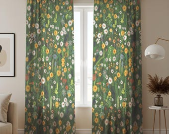 May include: A pair of green floral print curtains. The curtains feature a dense pattern of various flowers in shades of yellow, white, and orange, set against a dark green background. The curtains are hanging in front of a window.