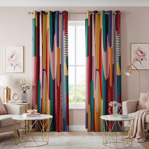 May include: Two colorful abstract patterned curtains with a geometric design in shades of red, yellow, green, blue, and purple. The curtains are hung on a window with a view of trees and a house in the distance.