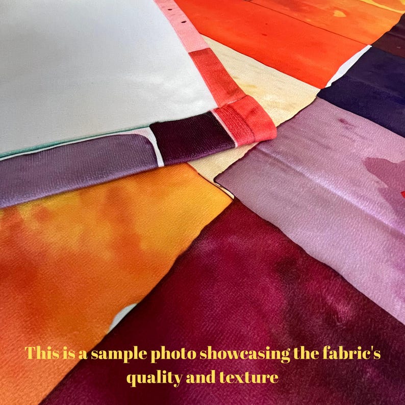a bunch of different colors of fabric on a table