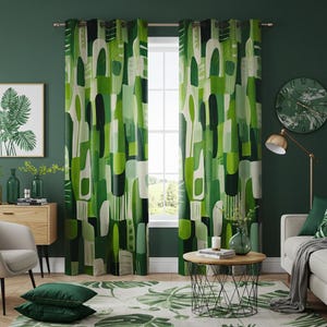 May include: Green and white geometric patterned curtains with a window behind them. The curtains are hung in a living room with a green wall, a sofa, a coffee table, and a plant.