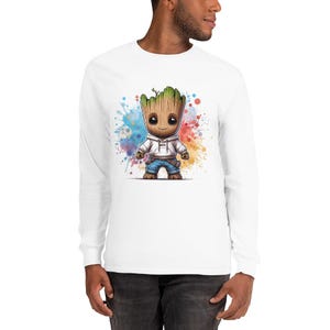 May include: White long-sleeve t-shirt with a colorful watercolor design featuring a cartoon character of Groot from Guardians of the Galaxy wearing a white hoodie and blue jeans.