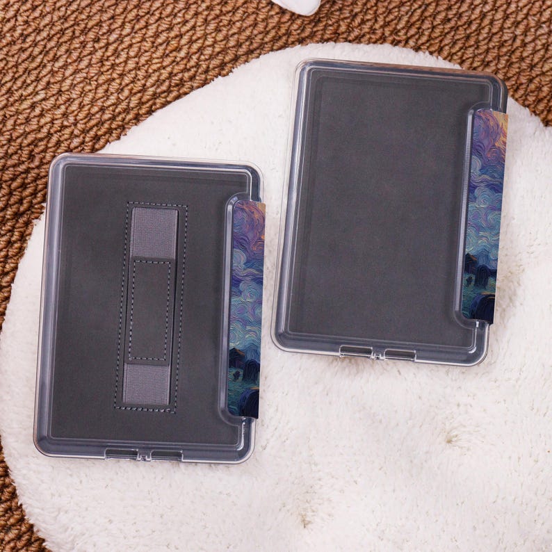 May include: Two clear protective cases for an e-reader. The cases have a dark gray interior and a stand. The edges of the cases are decorated with a colorful abstract design in shades of blue, purple, and yellow.