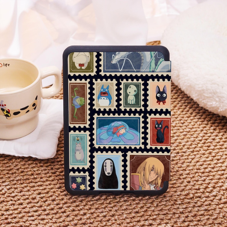 May include: Black tablet case with a collage of colourful postage stamp designs featuring anime characters. The stamps are arranged in a grid pattern, showcasing various illustrations. The case has a dark border and a smooth finish.