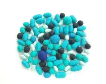 Tinker tray pebbles. Craft projects, blue felt ornaments, loose parts play, felt nugget, felted wool beads, felt pebbles, montessori play