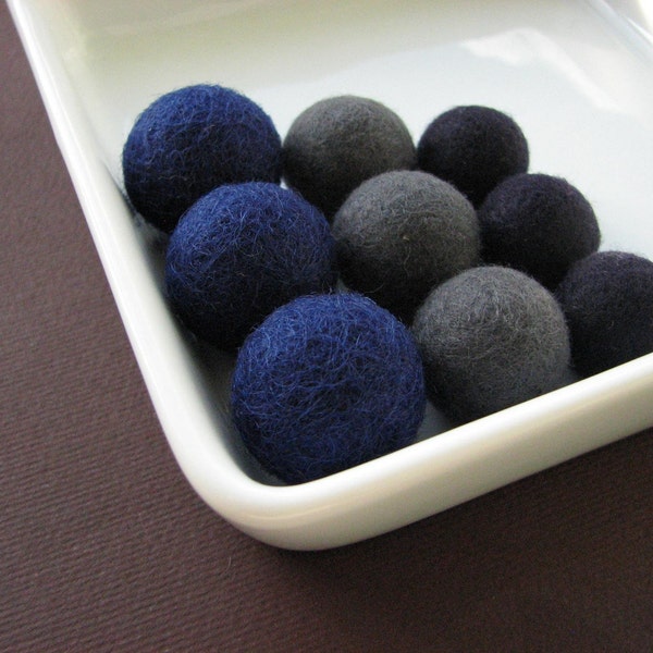 9 felted wool beads ( prussian blue, gray and especially dark blue)