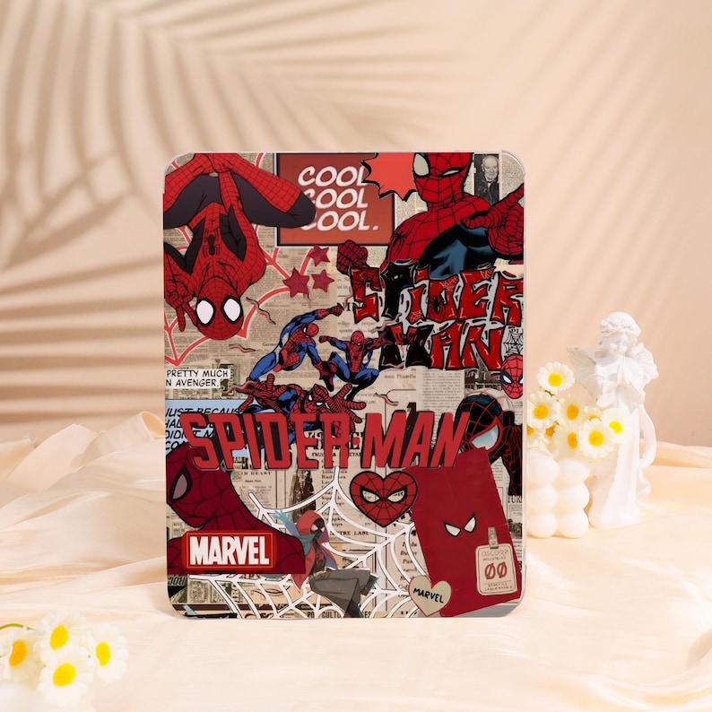 May include: A rectangular Spider-Man themed case featuring comic book style graphics. The design includes images of Spider-Man in various poses, the Marvel logo, and the words "COOL" and "SPIDER-MAN". The case has a collage-like appearance with a red and white color scheme.