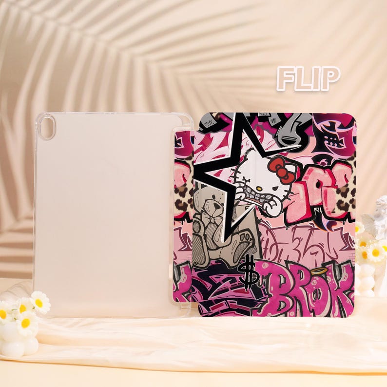 May include: A clear tablet case and a pink and black tablet cover with a graffiti-style design. The cover features a star, the text "BROK", and a cartoon cat character. The word "FLIP" is in the upper right corner.