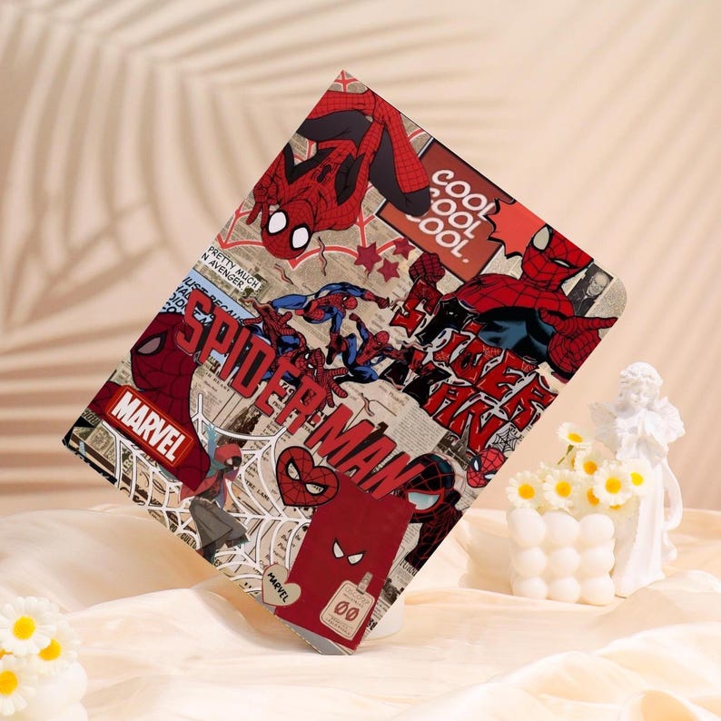 May include: A rectangular case featuring a collage of Spider-Man comic book art. The design includes images of Spider-Man in various poses, the word "SPIDER-MAN", and the Marvel logo. The color scheme is primarily red, black, and white.