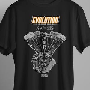 May include: Black t-shirt with a graphic of a motorcycle engine and the text "Evolution 1984-1999".