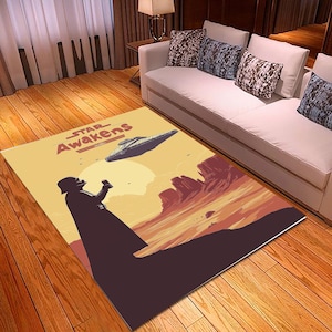 May include: A yellow and brown area rug with a Star Wars theme. The rug features Darth Vader, a Star Destroyer, and the text "Star Awakens".