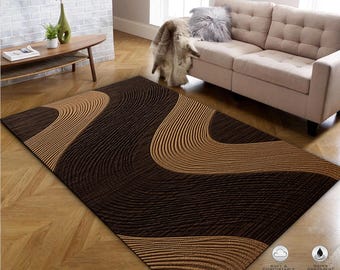 May include: A brown and beige area rug with a wavy, abstract design. The rug is soft and comfortable, water absorbent, and made from environmentally friendly materials.