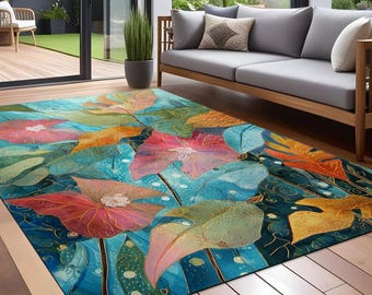 May include: A colorful area rug with a floral design featuring large, overlapping leaves in shades of pink, orange, yellow, and green on a blue background.