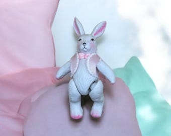 Vintage White Porcelain Jointed 4.5&quot; Bunny Figurine with Pink Vest
