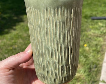 Handmade ceramic travel mug in green matte glaze