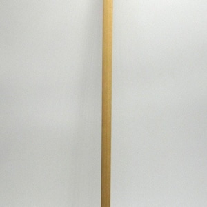 May include: A wooden clock pendulum with a brass-colored disc and a brass top. The pendulum is a light brown color and is designed for use in a clock. The disc is round and has a shiny finish.