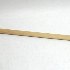 May include: A clock pendulum with a wooden rod and a circular brass disc. The rod is light brown, and the disc is a shiny gold color. The pendulum is designed for a clock mechanism.