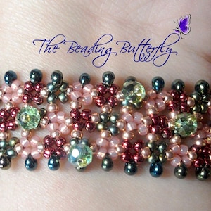 May include: A beaded bracelet with a multi-coloured design featuring pink, green, brown, and gold beads. The bracelet is made with small seed beads and larger faceted beads. The text "The Beading Butterfly" is visible in the background.
