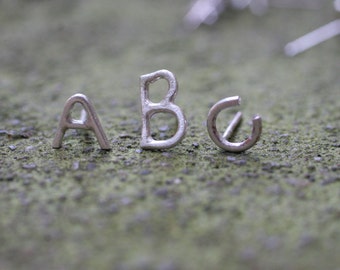 Alphabet letter stud earrings in 14k gold