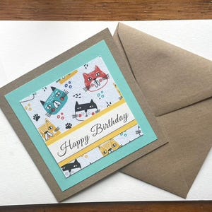 Carte de voeux Happy Cats en tissu avec bordure bleue : parfaite pour les amoureux des chats et pour les grandes occasions !