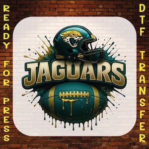 May include: A DTF transfer graphic featuring a teal football helmet with a jaguar logo, a teal football with gold laces, and the word JAGUARS in gold lettering. The text READY FOR PRESS DTF TRANSFER is visible on the sides of the design.