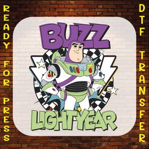 May include: A DTF (Direct to Film) transfer featuring Buzz Lightyear from Toy Story. The design includes the words "BUZZ LIGHTYEAR" in purple and green, with Buzz Lightyear in his signature space ranger suit. The words "READY FOR PRESS" and "DTF TRANSFER" are also visible.