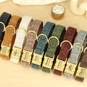 May include: A collection of personalized dog collars in various colors, including black, brown, white, and green. Each collar has a gold-colored buckle with a name and phone number engraved on it.