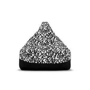 May include: A beanbag chair with a black and white abstract design. The top portion features a white background covered in black squiggly lines. The bottom band is solid black. The beanbag has a triangular shape.