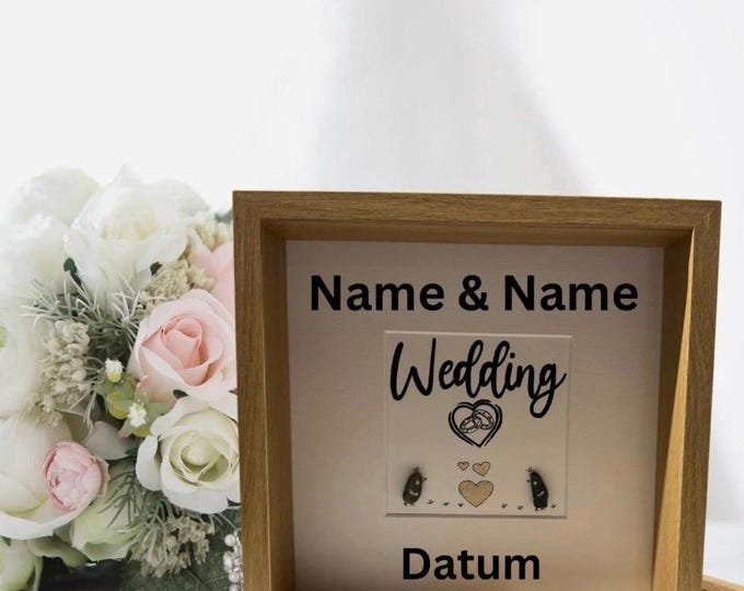 A personalized gift for the bride and groom with names and date in a picture frame. A wedding gift with a maritime touch featuring Baltic Sea stones.