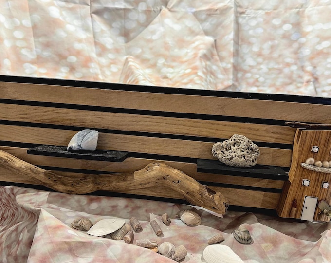 Modern wall panels with a small shelf, Scandinavian wooden houses, and driftwood from the Baltic and North Seas. Maritime wall decoration.
