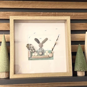 May include: A set of three ceramic mugs with a speckled, matte finish. The mugs are in shades of cream, light gray, and dark gray. Each mug has a simple, minimalist design, perfect for coffee or tea.