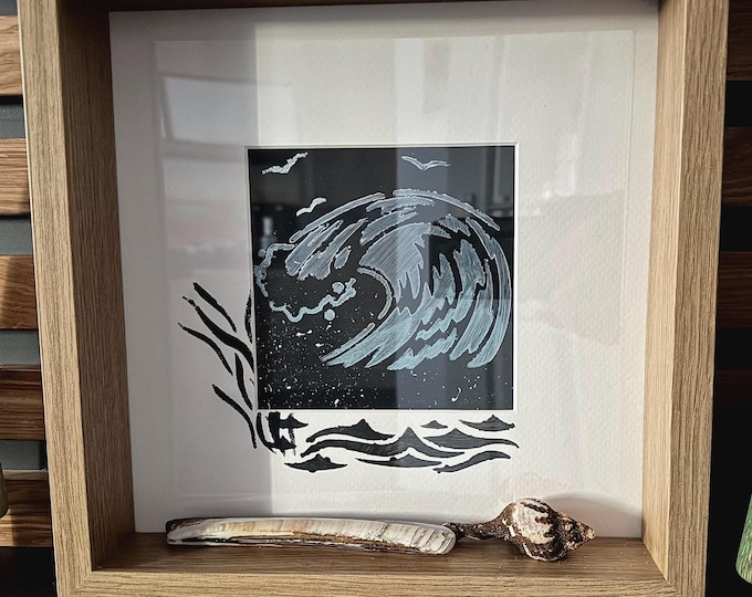 Maritime decoration with North Sea beach finds and acrylic painted wave in 3D picture frame.