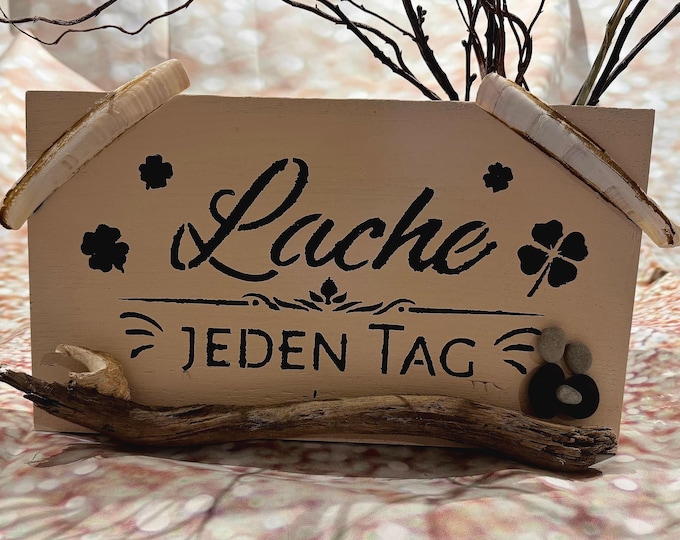 Maritime decorative vintage sign with Baltic Sea beach finds and North Sea shells in shabby chic style. Rustic wall decoration.