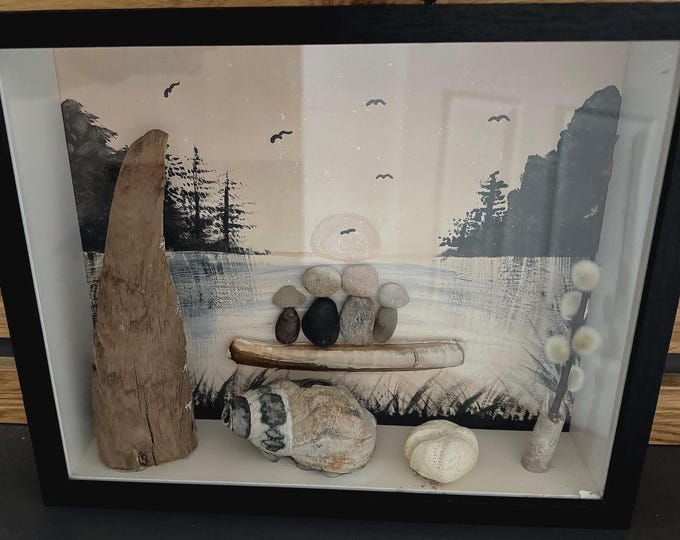 A maritime stone picture for Father's Day. Family decoration by the sea with driftwood and beach finds from the Baltic and North Seas.
