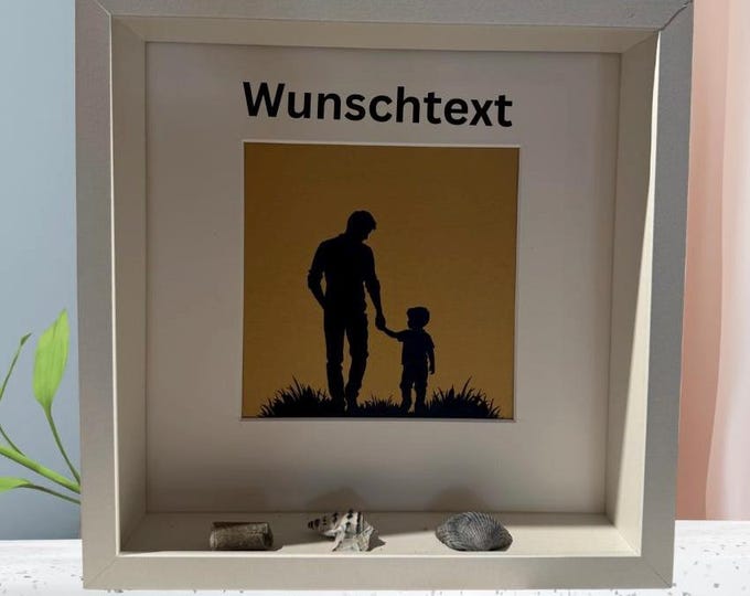 A gift for father's birthday from his son. Picture frame with a plotter motif and personalized text. Also available with North Sea beach finds.
