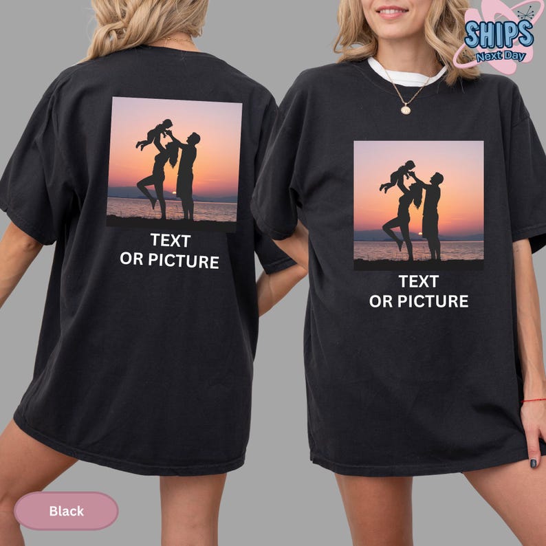 a woman wearing a black t - shirt with a picture of a man and woman