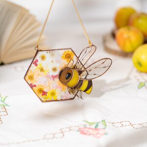 stained glass bee with transparent wings and yellow body details