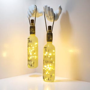Handmade Wall Sconce Set – Frosted Wine Bottle with Hand Sculpture & LED Fairy Lights (2-Piece)