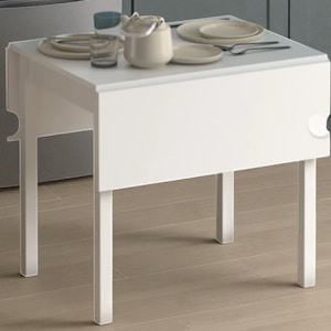 May include: A white, square, drop-leaf table with four straight legs. The table has a clean, minimalist design. Dishes, a teapot, and glasses are arranged on the tabletop. The table is approximately 61 cm wide and 61 cm long.